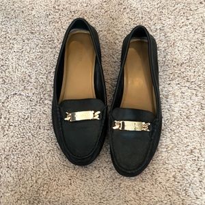 Black coach loafers with gold detail